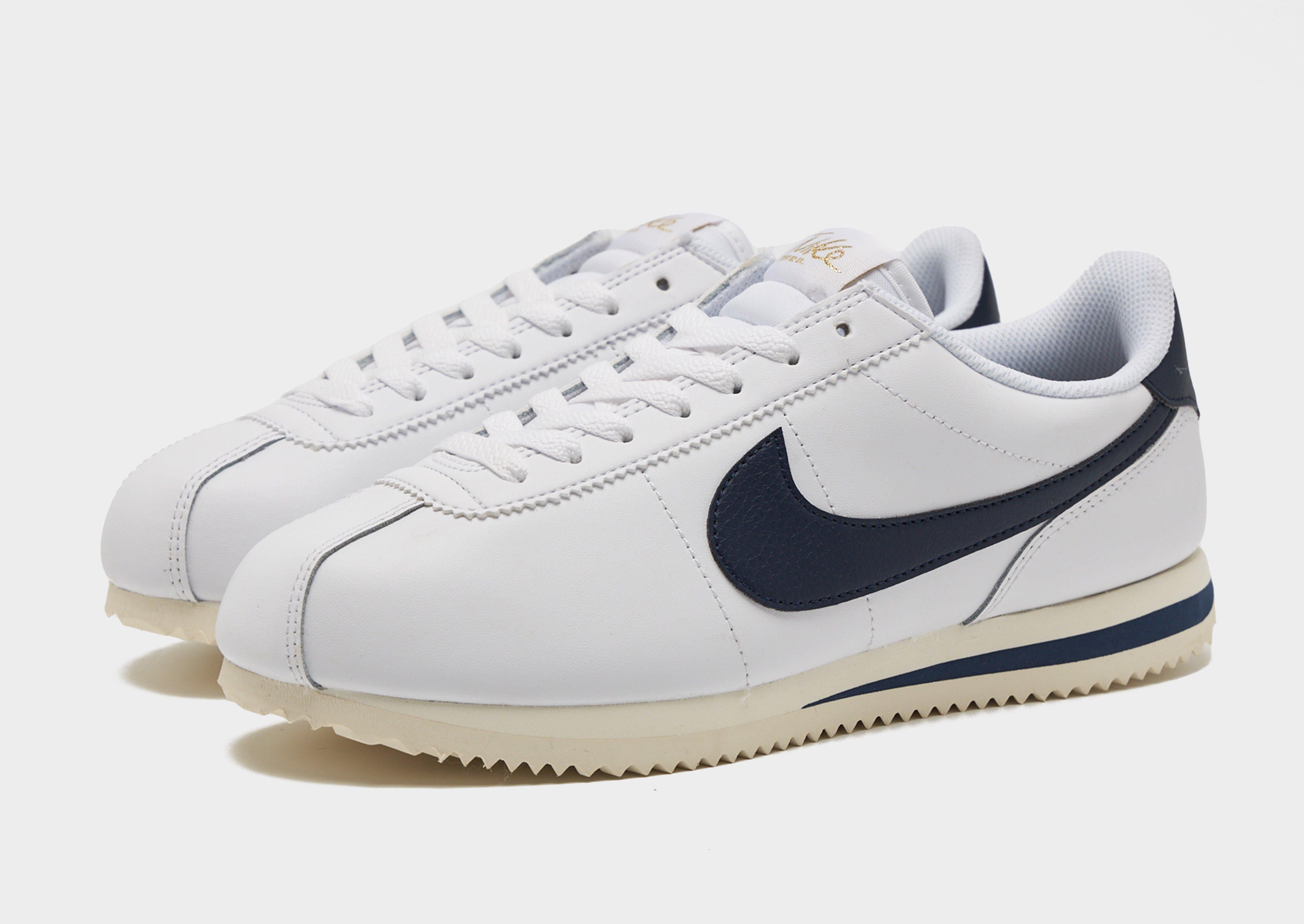 white and navy nike cortez